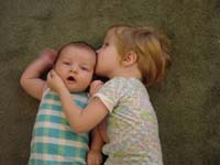 zb-08-31-siblings-floor-kiss